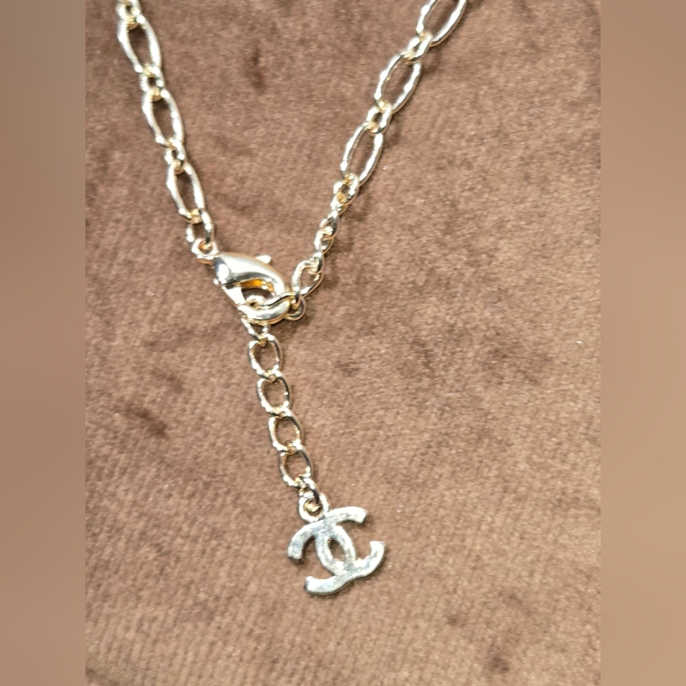 Gold Tone Logo Bracelet With Rocks - Picture 8 of 14